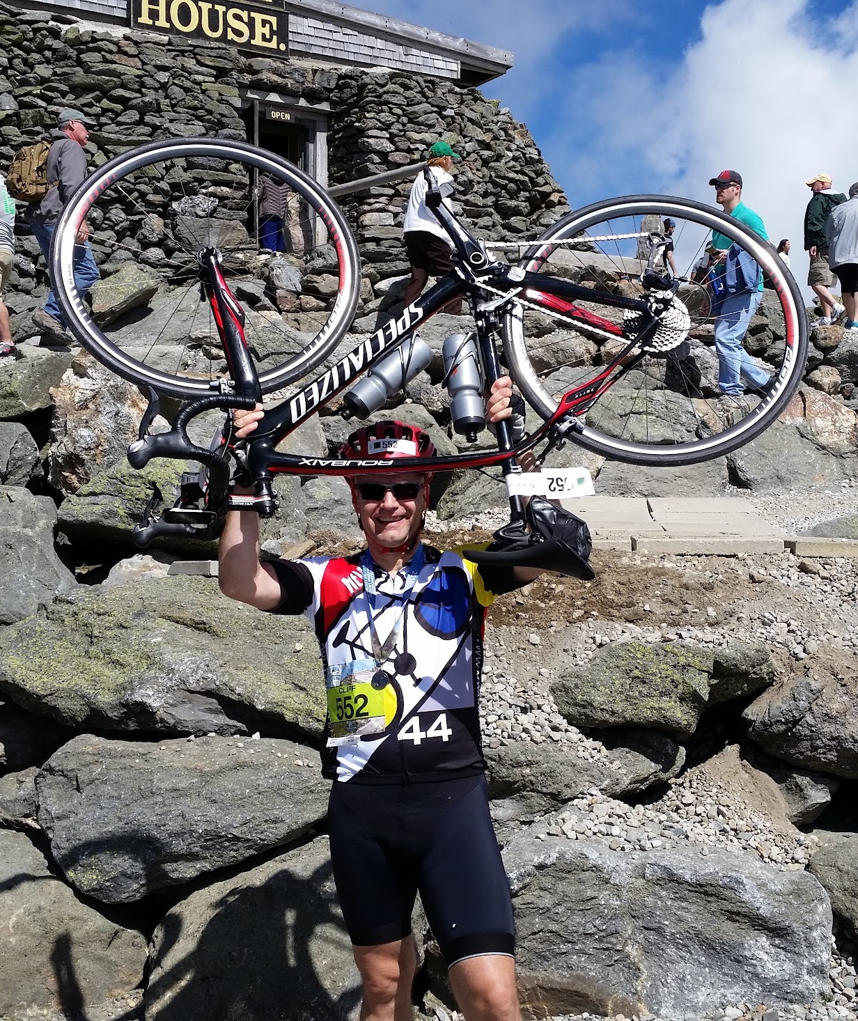 Cliff holding bike at summit